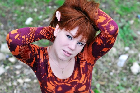 angle shoot of redheaded girl outdoors の写真素材