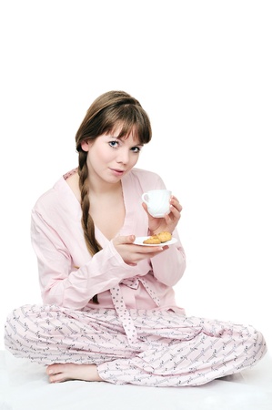 longhaired young woman drinking morning coffeeの写真素材