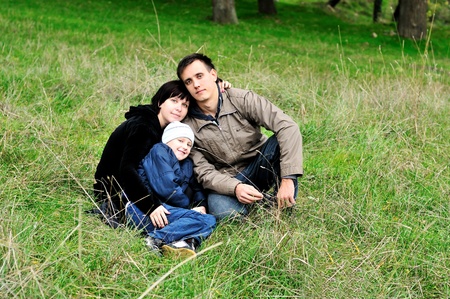 happy family  in the forest during early autumn の写真素材