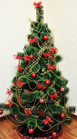 beautiful home Christmas Tree in red and gold colors の写真素材