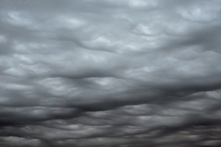 dark heavy gale black stormy ominous clouds の写真素材