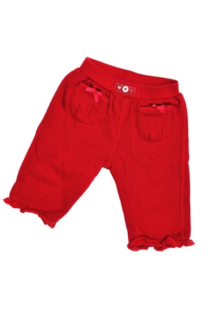 red baby girl's pants on over the whiteの写真素材