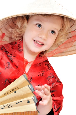 funny little girl wearing like oriental oneの写真素材