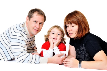 happy family laying over the white の写真素材