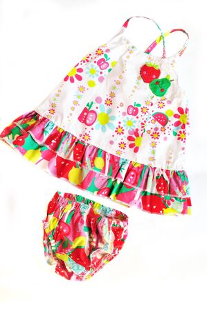 baby's set of panties and dress on over the whiteの写真素材