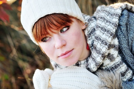 redheaded pensive girl in fall time 