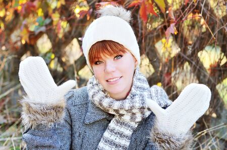 happy redheaded girl in fall time の写真素材