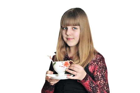 teen girl drinking a tea over the whiteの写真素材