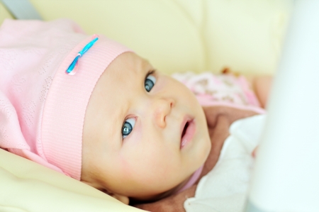 portrait of blue-eyed baby girl の写真素材