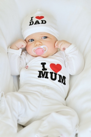 newborn girl wearing clothing with love to mum and dad  not trademark の写真素材