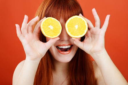 redhead girl with orange glassesの写真素材