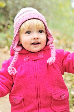 running sweet blonde toddler girlの写真素材