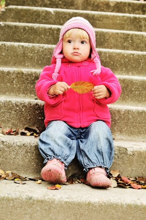 surprised toddler on the stairsの写真素材