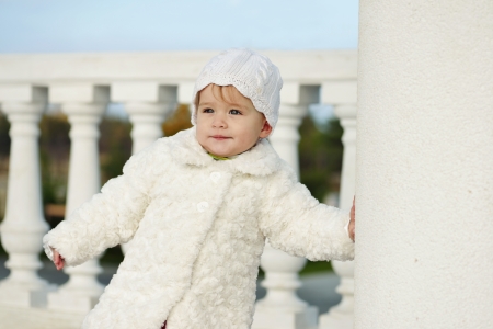 fashion baby girl wearing fur coatの写真素材