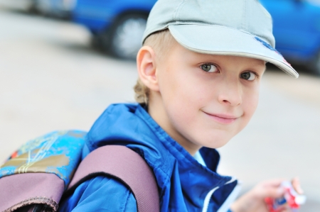 schoolboy with backpack going to homeの写真素材