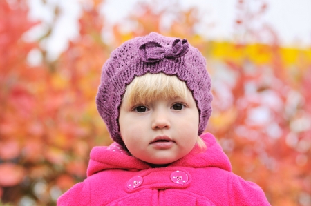 portrait of baby girl in fall timeの写真素材
