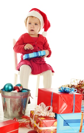 sad santa helper girl sitting on the chairの写真素材