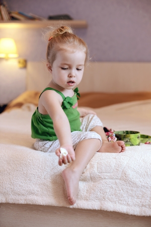 toddler girl at home in warm toningの写真素材