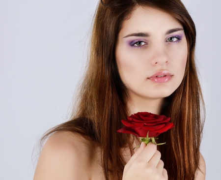 teen girl with red roseの写真素材