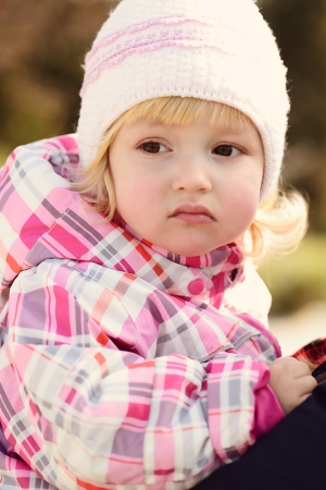 portrait  of toddler girl wearing winer clothingの写真素材