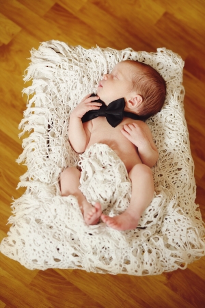 newborn boy wearing bow tieの写真素材