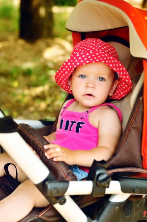 cute baby girl in the strollerの写真素材