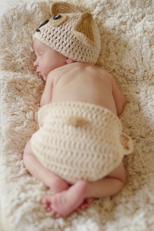 dreaming newborn wearing dog costumeの写真素材