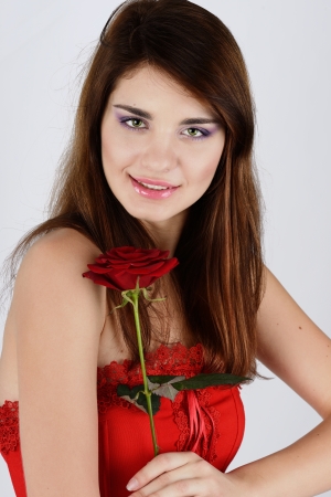 teen girl with red roseの写真素材