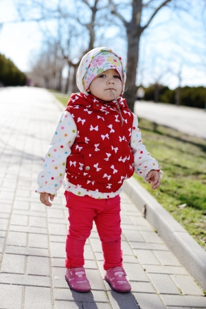 cute baby girl in the parkの写真素材