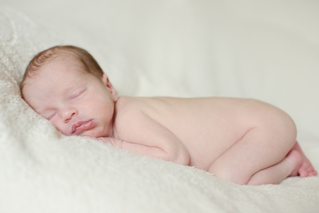 tender two weeks old sleeping newbornの写真素材