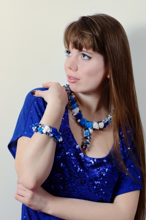 lady in blue dress and blue jeveleryの写真素材