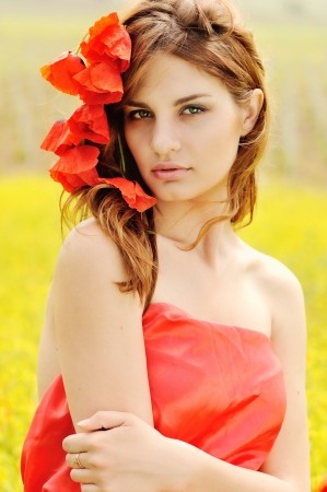 pretty teen girl with flowers over the headの写真素材