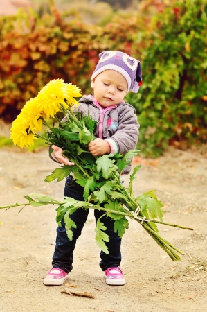 baby with flowers for motherの写真素材