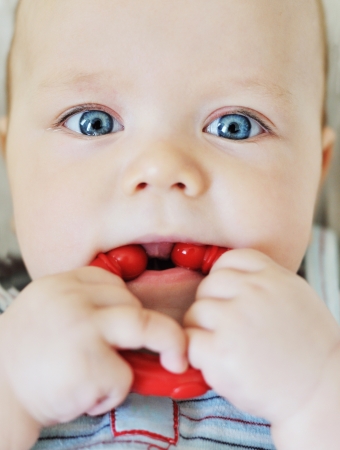  cute baby with teething ringの写真素材
