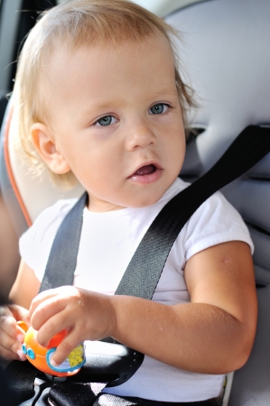 baby girl in car seatの写真素材