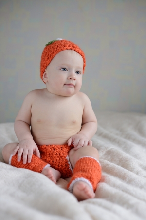 	chubby baby sitting on the sofaの写真素材
