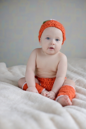 lovely baby sitting on the sofaの写真素材