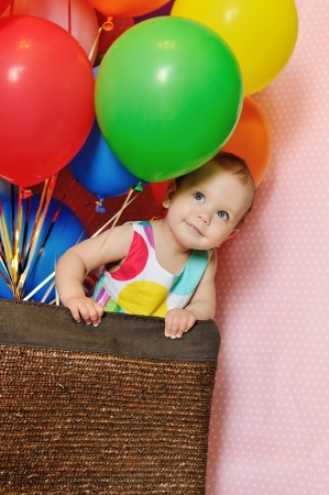birthday one year old girl with baloonsの写真素材
