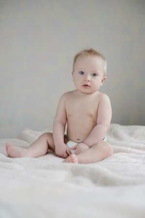 baby boy sitting on the sofaの写真素材