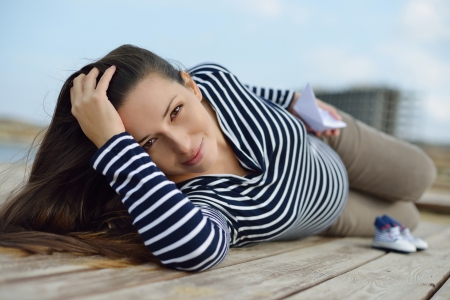 beautiful pregnant woman on the sea costの写真素材