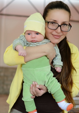 mother holding her little  babyの写真素材