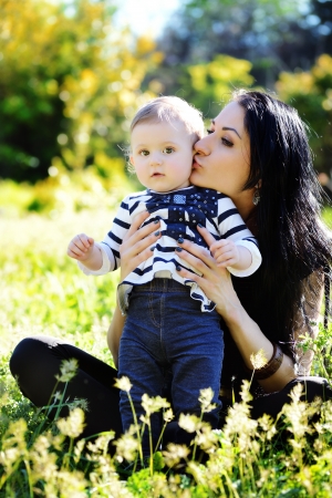 mother kissing her baby daughterの写真素材