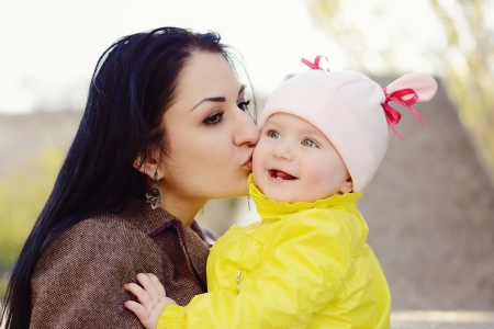 loving mother kissing her  babyの写真素材