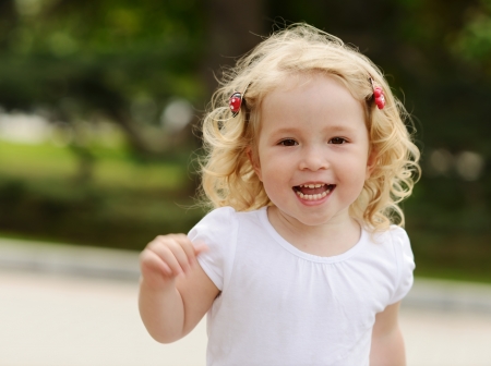  running toddler girl in motionの写真素材