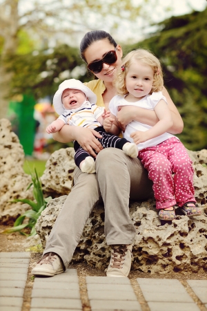 mother with little daughter and baby sonの写真素材