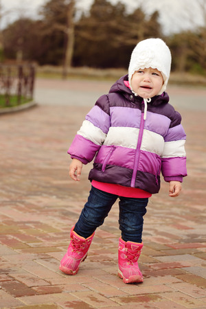 lost crying baby in the parkの写真素材