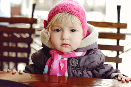 baby girl  in outdoor cafeの写真素材