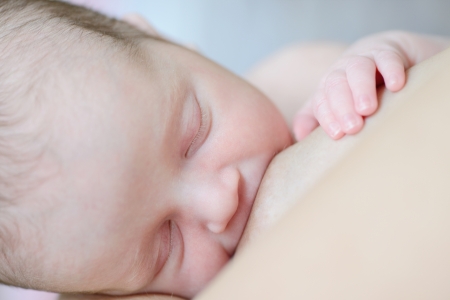 Breast-feeding of the newborn baby in soft selective focus
の写真素材