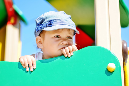 toddler girl on the playgroundの写真素材