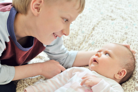 brother glad to see his baby sister